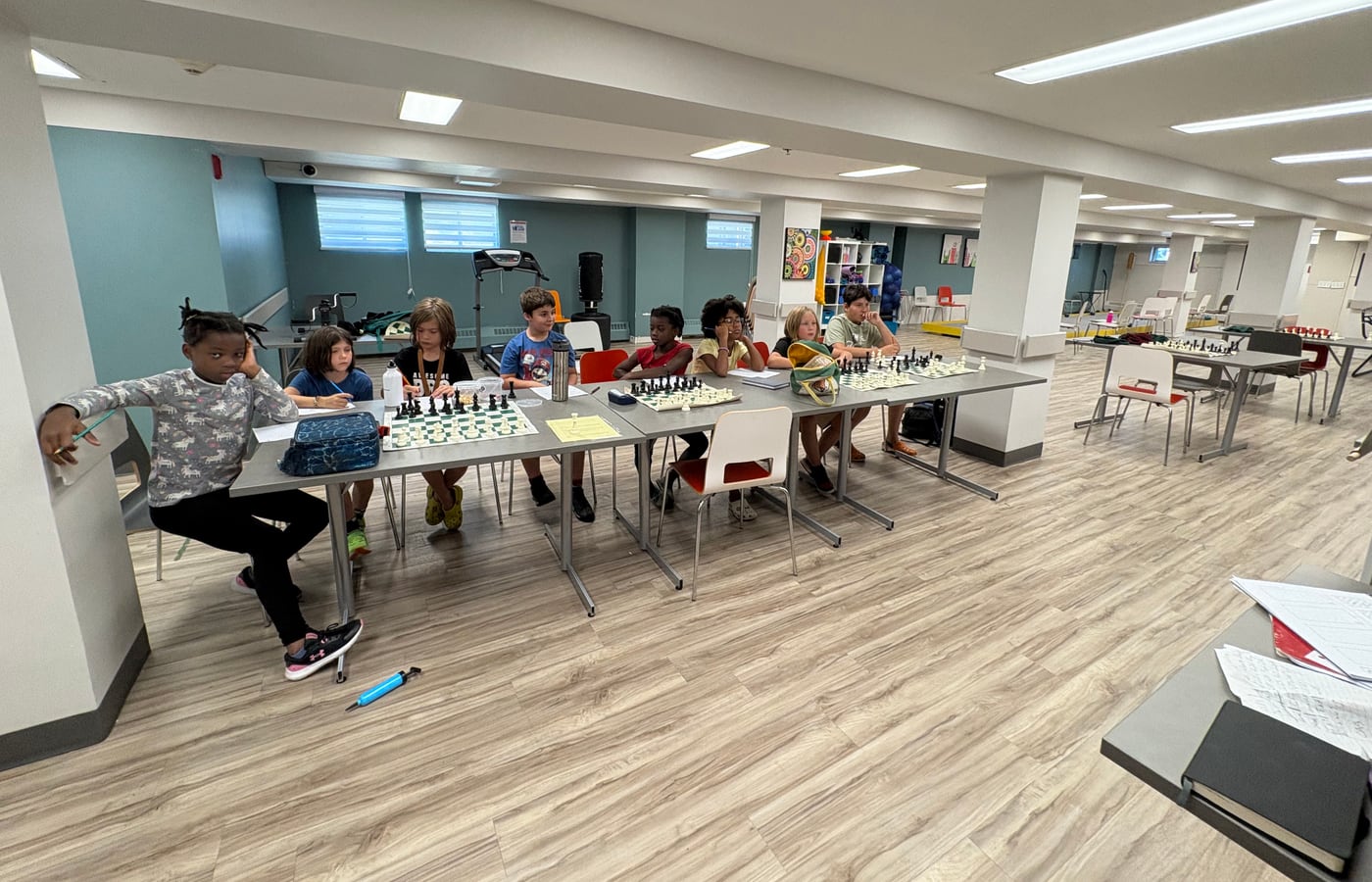 Group of young players gathered for a chess activity