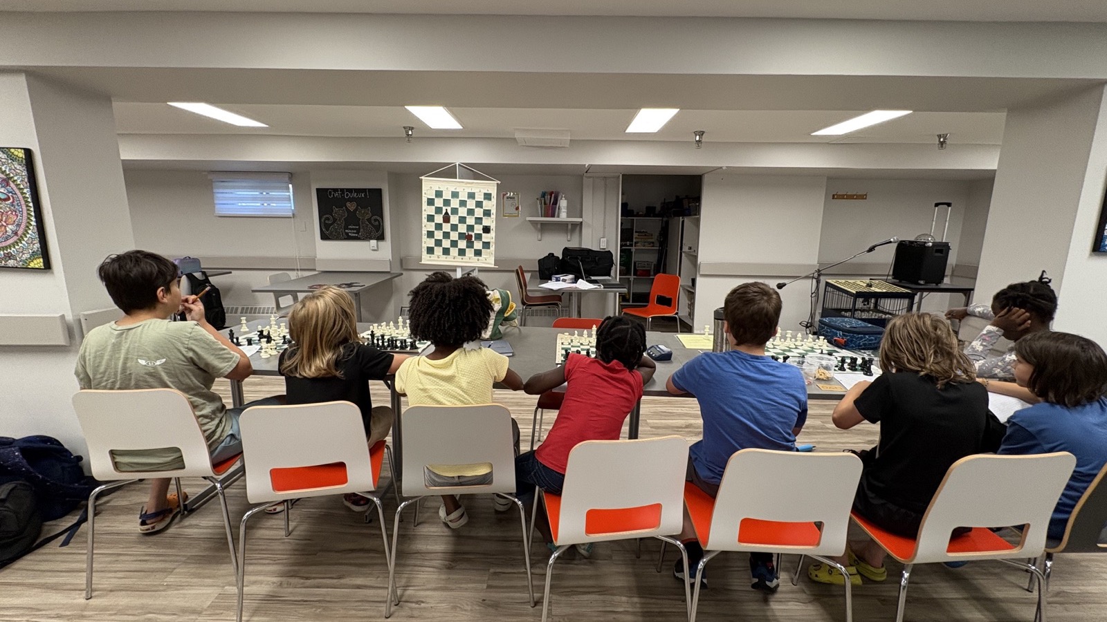 Group of young players during a chess lesson at summer camp