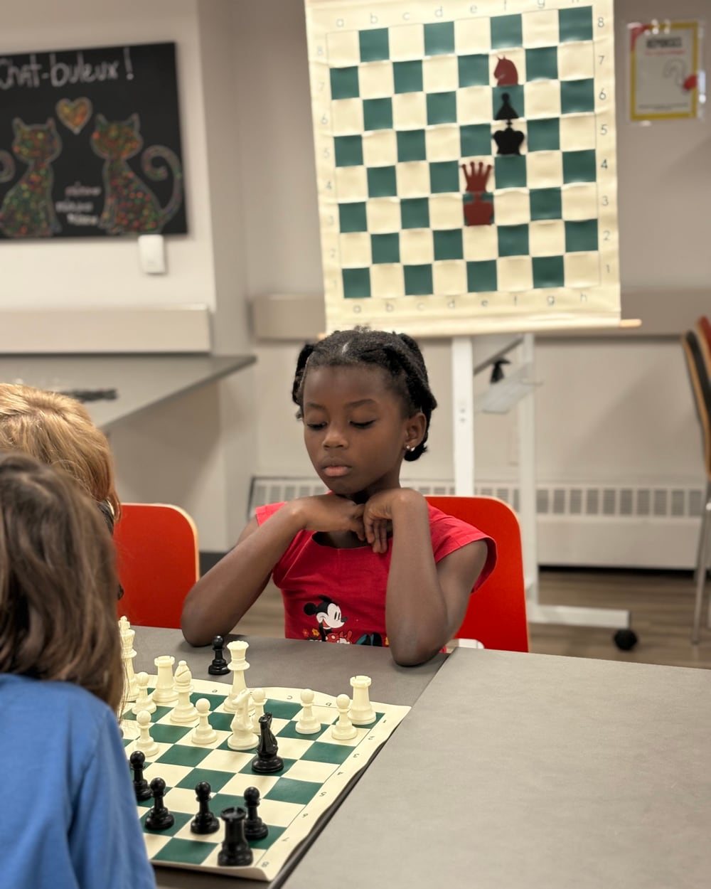 Young player concentrating on her chess game